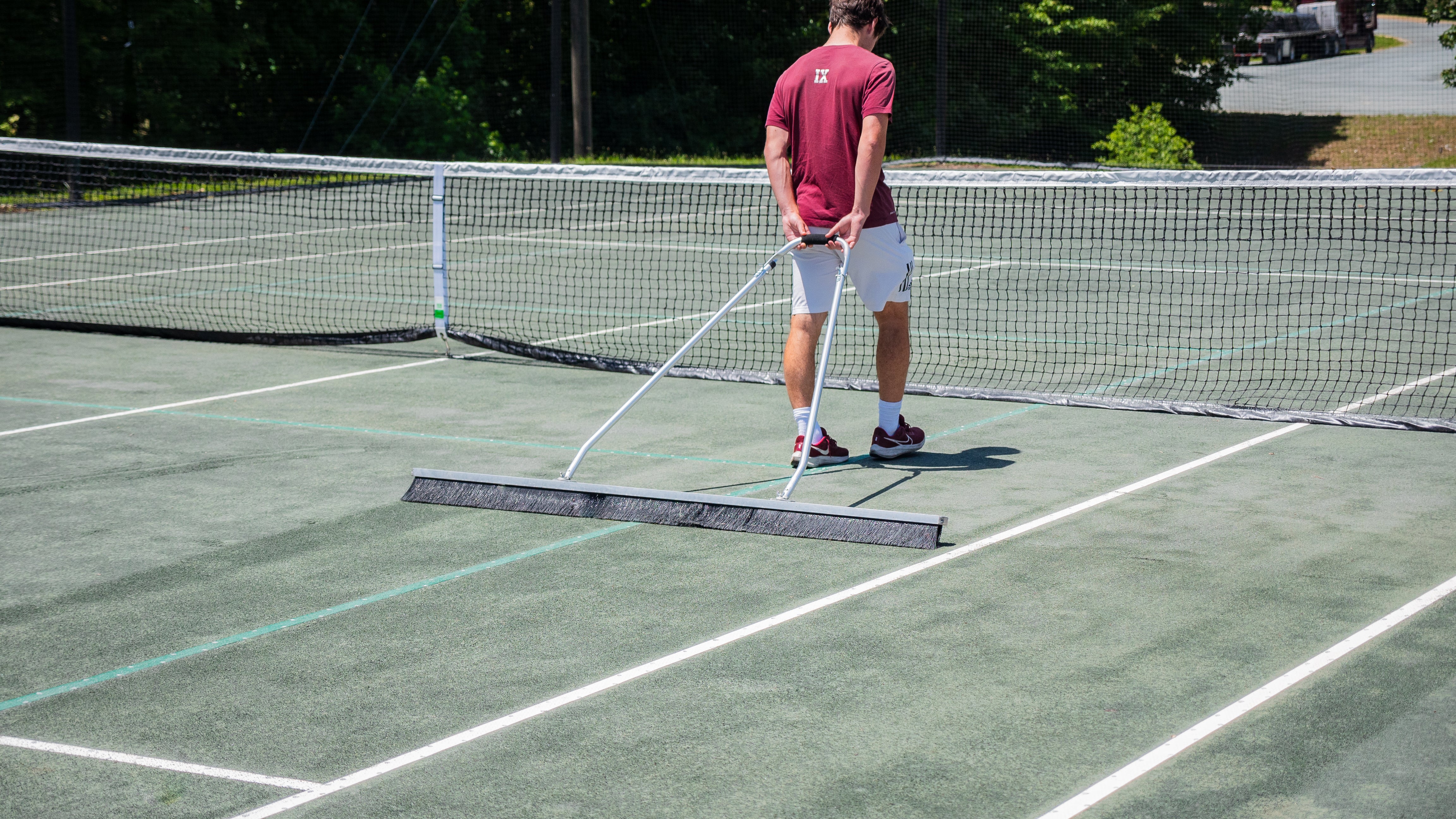 6' Har-Tru Drag Brush on tennis court