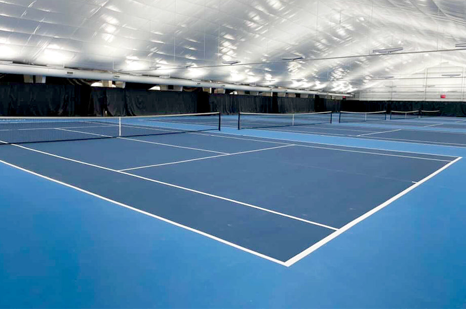 indoor tennis court under acrylic lighting