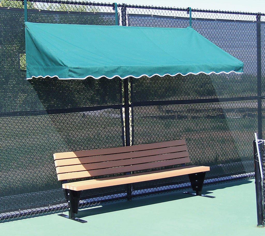 Forest green fence cabana covering tennis court bench in shade